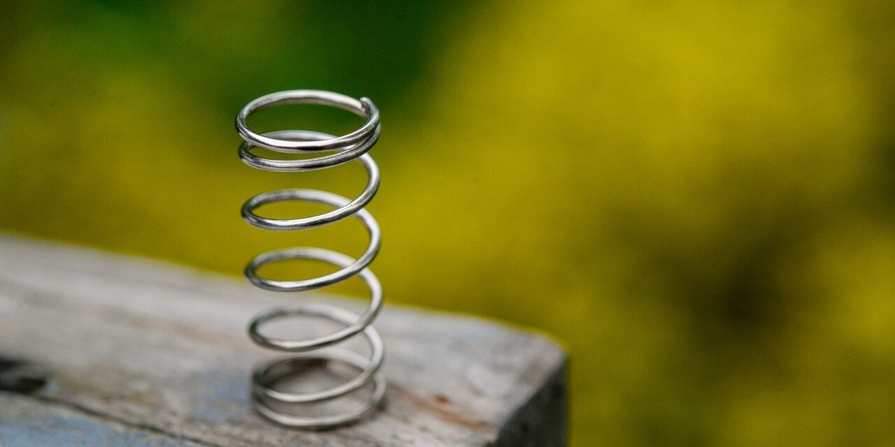 Veerkracht Een veer als beeld voor het tonen van veerkracht